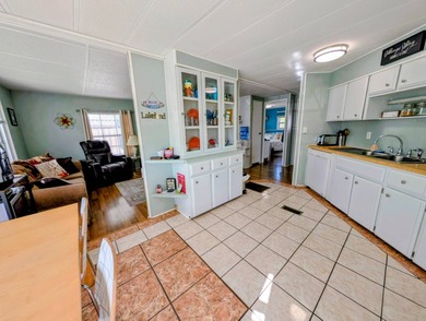 Turnkey Living! Expanded 2BR/2BA in Woodbrook Estates!  This on Grasslands Golf and Country Club in Florida - for sale on GolfHomes.com, golf home, golf lot