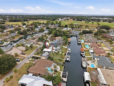 Deep water canal-front home in Gulf Breeze Featured on popular on Tiger Point Golf and Country Club in Florida - for sale on GolfHomes.com, golf home, golf lot