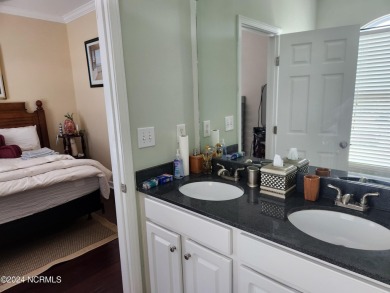 A beach getaway with three bedrooms PLUS an income producing on Sea Trail Golf Resort in North Carolina - for sale on GolfHomes.com, golf home, golf lot
