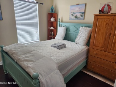 A beach getaway with three bedrooms PLUS an income producing on Sea Trail Golf Resort in North Carolina - for sale on GolfHomes.com, golf home, golf lot