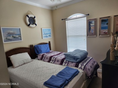 A beach getaway with three bedrooms PLUS an income producing on Sea Trail Golf Resort in North Carolina - for sale on GolfHomes.com, golf home, golf lot