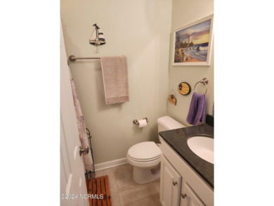 A beach getaway with three bedrooms PLUS an income producing on Sea Trail Golf Resort in North Carolina - for sale on GolfHomes.com, golf home, golf lot