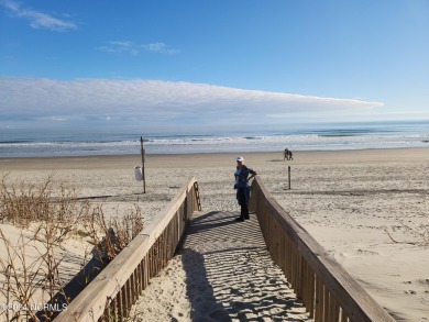 A beach getaway with three bedrooms PLUS an income producing on Sea Trail Golf Resort in North Carolina - for sale on GolfHomes.com, golf home, golf lot