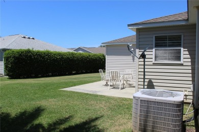 Inviting Sand Dollar model in The Villages' Sanibel neighborhood on Volusia Executive Golf Course  in Florida - for sale on GolfHomes.com, golf home, golf lot