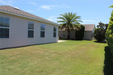 Inviting Sand Dollar model in The Villages' Sanibel neighborhood on Volusia Executive Golf Course  in Florida - for sale on GolfHomes.com, golf home, golf lot