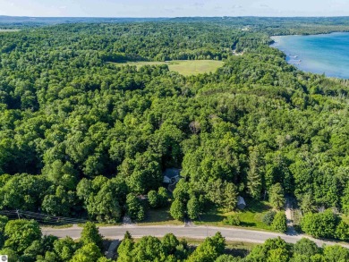 Tucked into the heart of Leelanau County, this beautifully treed on Manitou Passage Golf Club in Michigan - for sale on GolfHomes.com, golf home, golf lot