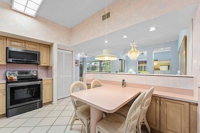 Inviting sun-splashed ground-floor condo with lovely golf and on Polo Club of Boca Raton in Florida - for sale on GolfHomes.com, golf home, golf lot