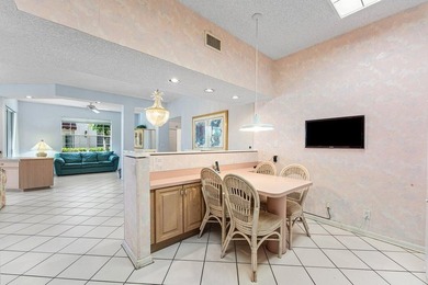 Inviting sun-splashed ground-floor condo with lovely golf and on Polo Club of Boca Raton in Florida - for sale on GolfHomes.com, golf home, golf lot