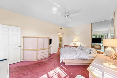 Inviting sun-splashed ground-floor condo with lovely golf and on Polo Club of Boca Raton in Florida - for sale on GolfHomes.com, golf home, golf lot