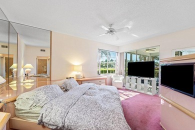 Inviting sun-splashed ground-floor condo with lovely golf and on Polo Club of Boca Raton in Florida - for sale on GolfHomes.com, golf home, golf lot