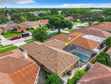 Welcome to your dream home in the serene Feather Sound Country on Feather Sound Country Club in Florida - for sale on GolfHomes.com, golf home, golf lot