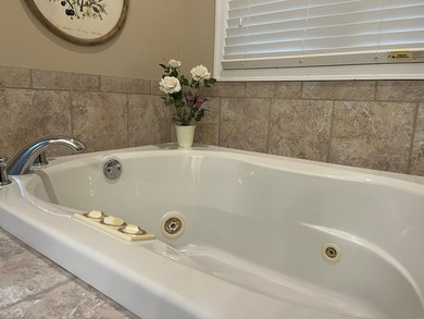 Charming 4BR/3BA brick home overlooking the signature 16th hole on Glade Springs Resort Golf Course in West Virginia - for sale on GolfHomes.com, golf home, golf lot
