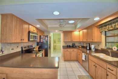 Discover this well-maintained 3-bedroom, 2.5-bath home on Cypresswood Golf and Country Club in Florida - for sale on GolfHomes.com, golf home, golf lot