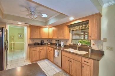 Discover this well-maintained 3-bedroom, 2.5-bath home on Cypresswood Golf and Country Club in Florida - for sale on GolfHomes.com, golf home, golf lot