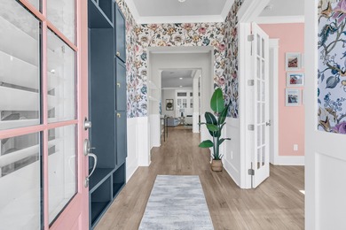 Step inside this impressive three-story residence in the on Dunes West Golf Club in South Carolina - for sale on GolfHomes.com, golf home, golf lot