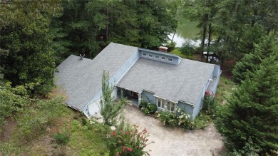 This 3 bed, 2 bath single-story home sits on the smaller fishing on Fairfield Plantation Golf and Country Club in Georgia - for sale on GolfHomes.com, golf home, golf lot
