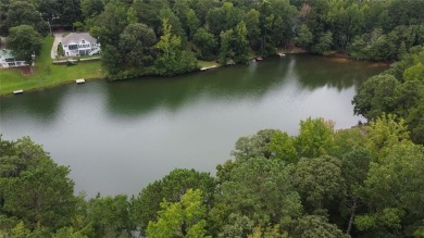 This 3 bed, 2 bath single-story home sits on the smaller fishing on Fairfield Plantation Golf and Country Club in Georgia - for sale on GolfHomes.com, golf home, golf lot