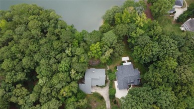 This 3 bed, 2 bath single-story home sits on the smaller fishing on Fairfield Plantation Golf and Country Club in Georgia - for sale on GolfHomes.com, golf home, golf lot