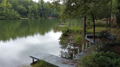 This 3 bed, 2 bath single-story home sits on the smaller fishing on Fairfield Plantation Golf and Country Club in Georgia - for sale on GolfHomes.com, golf home, golf lot