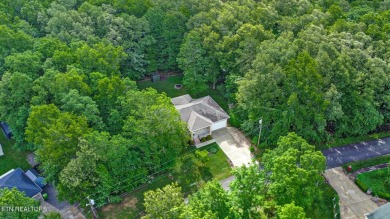 Check out this great home with beautiful views located right on Lake Tansi Village Country Club in Tennessee - for sale on GolfHomes.com, golf home, golf lot