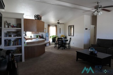 3-bedroom, 2-bath manufactured home on a large 0.67-acre lot in on Sierra Del Rio Golf Club in New Mexico - for sale on GolfHomes.com, golf home, golf lot