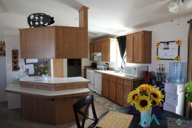 3-bedroom, 2-bath manufactured home on a large 0.67-acre lot in on Sierra Del Rio Golf Club in New Mexico - for sale on GolfHomes.com, golf home, golf lot
