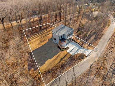 Welcome to a brand new, striking contemporary home! Thoughtfully on Branchwood Golf Course in Arkansas - for sale on GolfHomes.com, golf home, golf lot