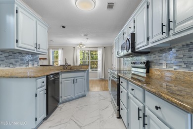 Welcome to this beautifully updated 3-bedroom, 2-bath home on Gulf Hills Golf Club in Mississippi - for sale on GolfHomes.com, golf home, golf lot