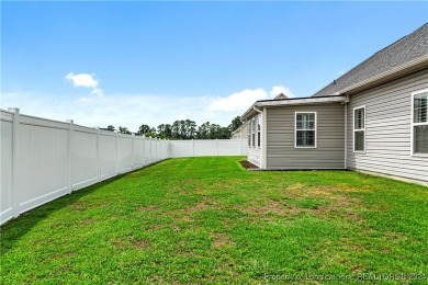 This inviting 4-bedroom, 2-bath home is nestled in PineCrest on Pinecrest Country Club in North Carolina - for sale on GolfHomes.com, golf home, golf lot