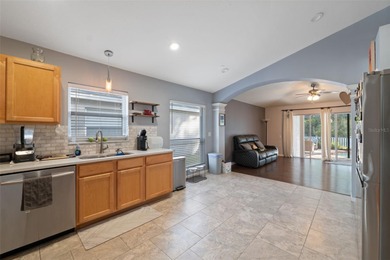 Discover this beautifully updated 4-bedroom, 2-bath home with a on Lexington Oaks Golf Club in Florida - for sale on GolfHomes.com, golf home, golf lot