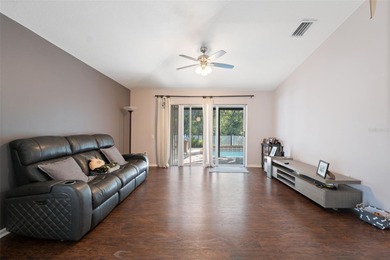Discover this beautifully updated 4-bedroom, 2-bath home with a on Lexington Oaks Golf Club in Florida - for sale on GolfHomes.com, golf home, golf lot