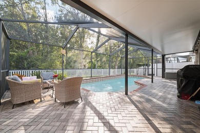 Discover this beautifully updated 4-bedroom, 2-bath home with a on Lexington Oaks Golf Club in Florida - for sale on GolfHomes.com, golf home, golf lot