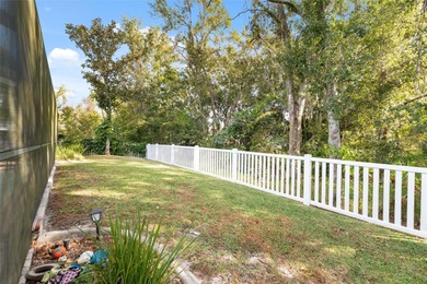 Discover this beautifully updated 4-bedroom, 2-bath home with a on Lexington Oaks Golf Club in Florida - for sale on GolfHomes.com, golf home, golf lot