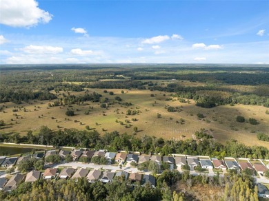 Discover this beautifully updated 4-bedroom, 2-bath home with a on Lexington Oaks Golf Club in Florida - for sale on GolfHomes.com, golf home, golf lot