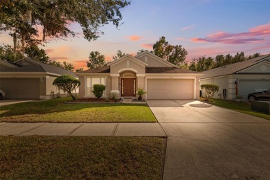 Discover this beautifully updated 4-bedroom, 2-bath home with a on Lexington Oaks Golf Club in Florida - for sale on GolfHomes.com, golf home, golf lot