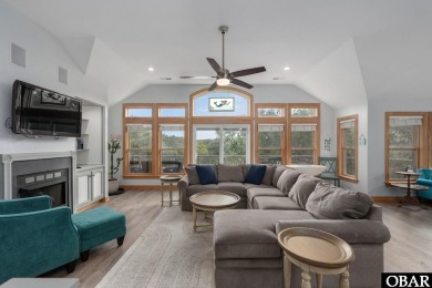 This beautifully updated and versatile coastal retreat offers on Duck Woods Country Club in North Carolina - for sale on GolfHomes.com, golf home, golf lot