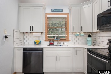 This beautifully updated and versatile coastal retreat offers on Duck Woods Country Club in North Carolina - for sale on GolfHomes.com, golf home, golf lot