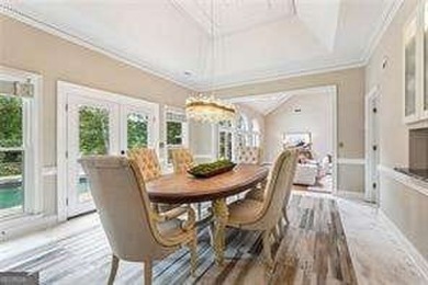 Tucked in Atlanta Country Club's quiet interior, this refreshed on Atlanta Country Club in Georgia - for sale on GolfHomes.com, golf home, golf lot