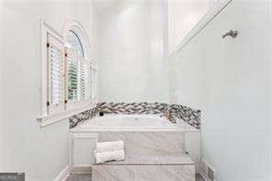 Tucked in Atlanta Country Club's quiet interior, this refreshed on Atlanta Country Club in Georgia - for sale on GolfHomes.com, golf home, golf lot