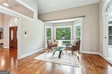 Tucked in Atlanta Country Club's quiet interior, this refreshed on Atlanta Country Club in Georgia - for sale on GolfHomes.com, golf home, golf lot