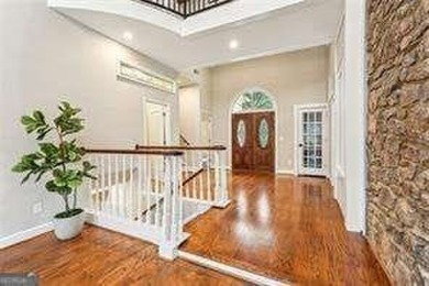 Tucked in Atlanta Country Club's quiet interior, this refreshed on Atlanta Country Club in Georgia - for sale on GolfHomes.com, golf home, golf lot