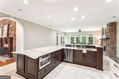 Tucked in Atlanta Country Club's quiet interior, this refreshed on Atlanta Country Club in Georgia - for sale on GolfHomes.com, golf home, golf lot