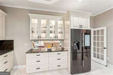 Tucked in Atlanta Country Club's quiet interior, this refreshed on Atlanta Country Club in Georgia - for sale on GolfHomes.com, golf home, golf lot