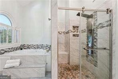 Tucked in Atlanta Country Club's quiet interior, this refreshed on Atlanta Country Club in Georgia - for sale on GolfHomes.com, golf home, golf lot