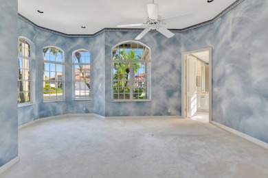 Lovely 5-bedroom + office home with southern exposure, located on St. Andrews Country Club of Boca Raton in Florida - for sale on GolfHomes.com, golf home, golf lot