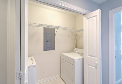 Beautiful two story condo in popular Ellington Woods Dunes West on Dunes West Golf Club in South Carolina - for sale on GolfHomes.com, golf home, golf lot