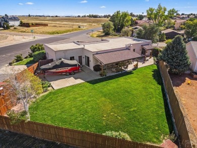 Welcome to this one-of-a-kind Santa Fe-style ranch home on Desert Hawk At Pueblo West in Colorado - for sale on GolfHomes.com, golf home, golf lot