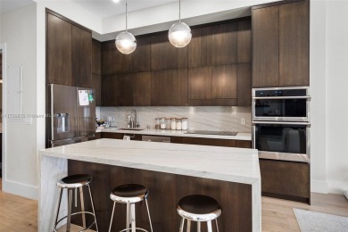 Meridian Lofts Residence #411 is a sleek 2-bed, 2.5-bath on Miami Beach Golf Club in Florida - for sale on GolfHomes.com, golf home, golf lot