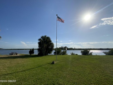 SPECTACULAR RIVERFRONT CONDO VILLA WITH BEACH, WATERWAY, POOL on Ocean Palm Golf Course in Florida - for sale on GolfHomes.com, golf home, golf lot