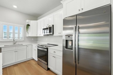 Welcome Home to luxury in this 2BD/2BA/2CG cottage home on an on Venetian Bay Golf Course in Florida - for sale on GolfHomes.com, golf home, golf lot